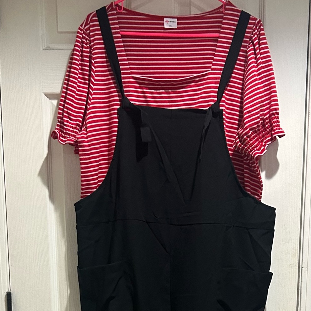 Black, oversized bib jumper. Never worn.